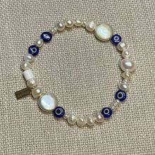 Load image into Gallery viewer, Freshwater pearl and glass evil eye bead stretch bracelet with signature Fangirl Unauthorised tag
